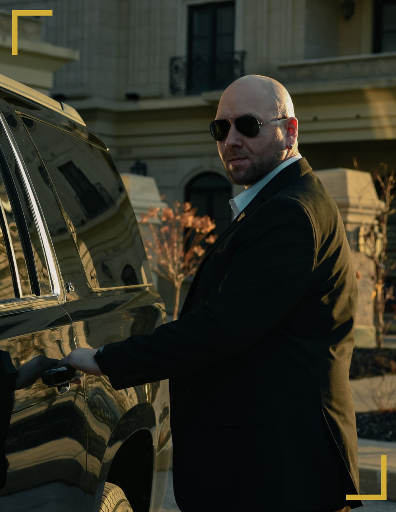 Cody Miller beside a protection vehicle