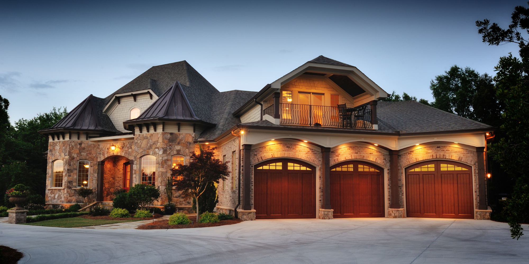 Private residence with warm exterior lighting at dusk
